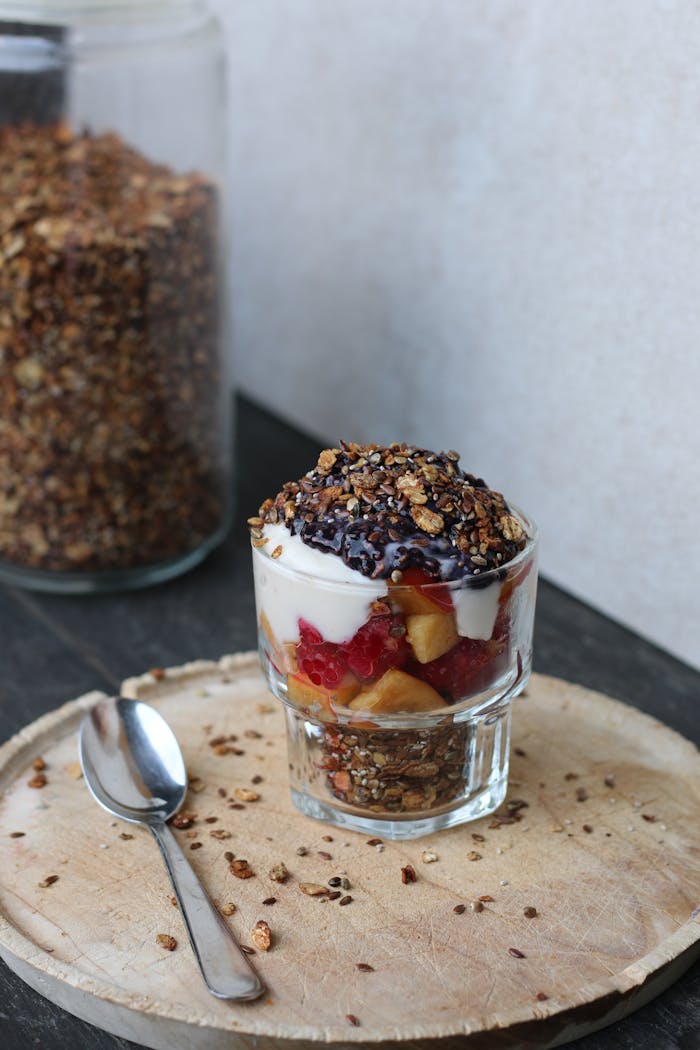 Delicious granola yogurt parfait with fresh fruit and nuts, perfect for a healthy breakfast or snack.